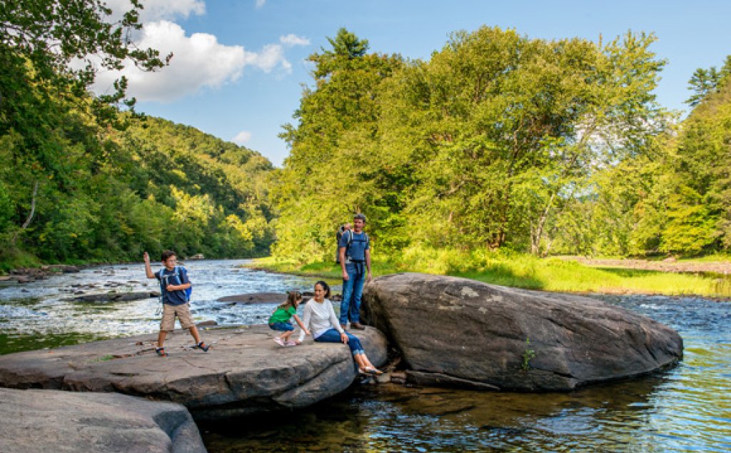 Greenbrier River Trail family on rocks.