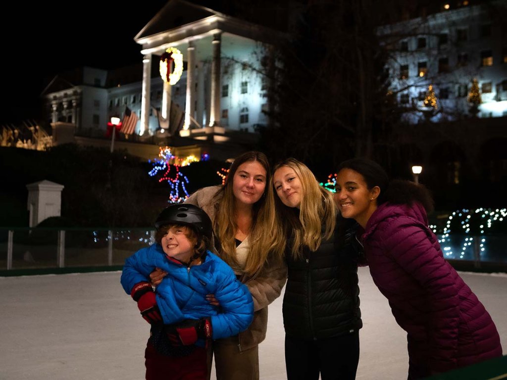 kids posing on the greenbrier resort skating rink.